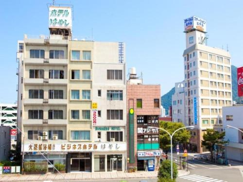 a tall building in the middle of a city at Hotel Hayashi - Vacation STAY 49805v in Beppu