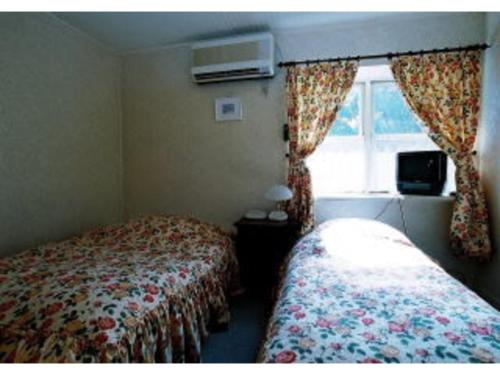 Ліжко або ліжка в номері Gasthof Ami - Vacation STAY 96507v