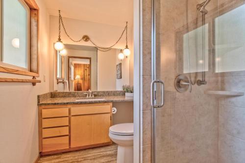 a bathroom with a shower and a toilet and a sink at Killdeer - Unit 6 in Sunriver