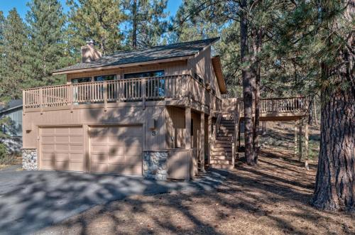 a house with a balcony and a garage at Lynx - Unit 3 in Sunriver