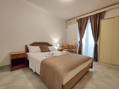 Postel nebo postele na pokoji v ubytování Villa Hera