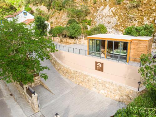 a house on the side of a mountain at Casas Du Rio in Maceira