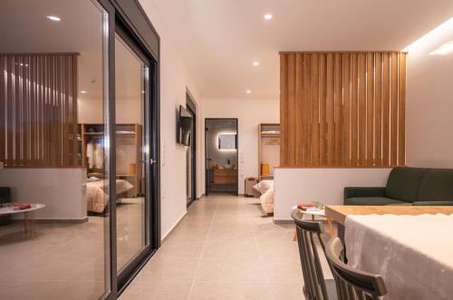 a living room with a couch and a table at Casatino Villas in Kalianeika