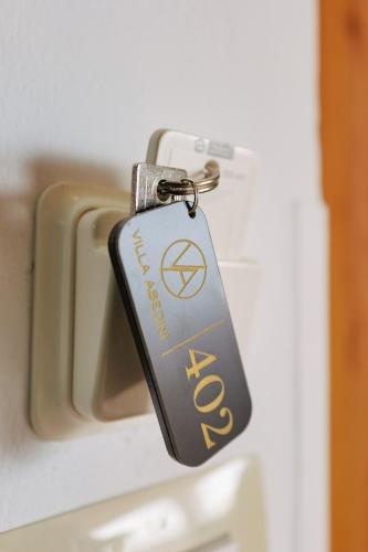 a key chain is attached to an open refrigerator at Villa Abedini in Ksamil