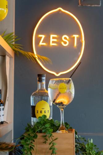 a neon sign with a glass of wine and a bottle at ibis Concepcion in Concepción
