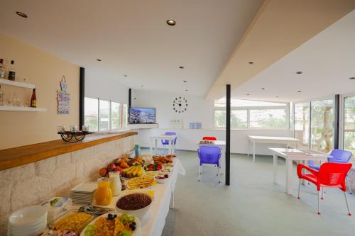 a kitchen with a table with food on it at Villa Abedini in Ksamil