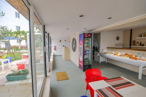 a kitchen and dining room with a table and chairs at Villa Abedini in Ksamil