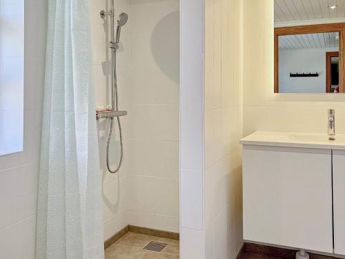 a bathroom with a shower and a sink at Holiday home Østervrå II in Østervrå