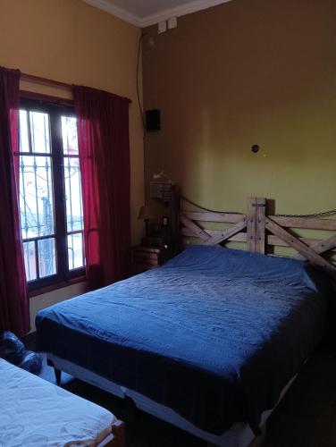 מיטה או מיטות בחדר ב-Casa quinta LA ESPERADA