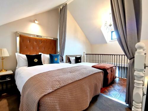 a bedroom with a large bed in a attic at The Salisbury in Christchurch
