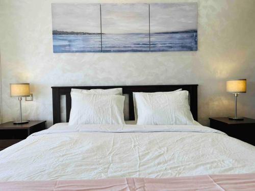 Ein Bett oder Betten in einem Zimmer der Unterkunft DreamParc - Vue sur Mer et Parc Securite 24H
