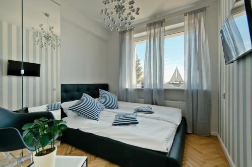Cama ou camas em um quarto em Sopot Holiday Rooms