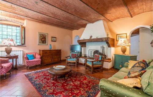 a living room with a couch and a table at Cozy Apartment In Molino Del Piano in Molino del Piano