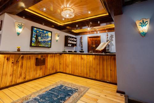 a room with a bar with a rug on the floor at Hotel Parque México Suites at Condesa in Mexico City