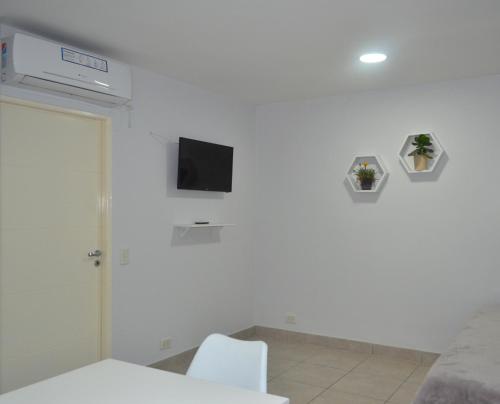 A television and/or entertainment centre at DEPARTAMENTOS DORREGO 2