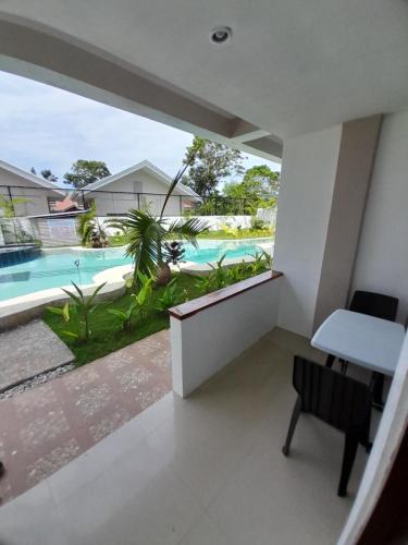 a balcony with a view of a swimming pool at Francisco Resort in Panglao