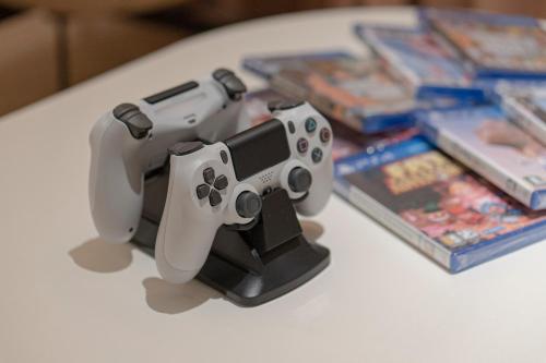 two video game controllers sitting on top of a table at Aank Hotel Daejeon Yuseong 1st in Daejeon