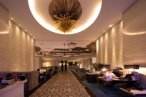 a lobby of a hotel with a chandelier at A&EM Phan Boi Chau in Ho Chi Minh City