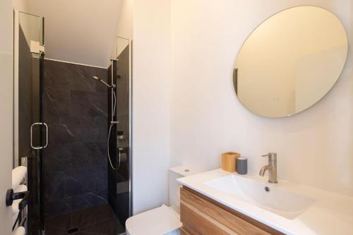 a bathroom with a sink and a mirror at Remarkables View, 1BDR, Wi-Fi in Frankton Wharf
