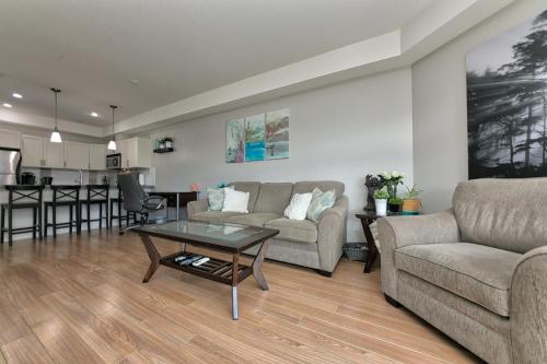 a living room with a couch and a table at Stay In The Okanagan - Copper Sky, West Kelowna in West Kelowna