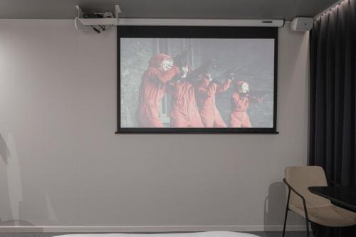 a painting of a group of people on a wall at Aank Hotel Daejeon Yuseong 2nd in Daejeon