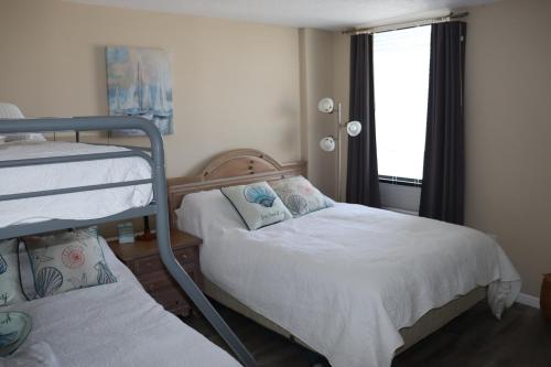 Postel nebo postele na pokoji v ubytování Beach Luxury Oceanfront