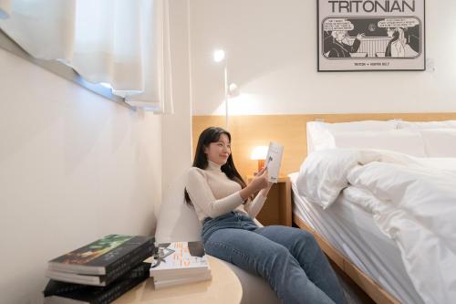 Postel nebo postele na pokoji v ubytování Aank Hotel Guri