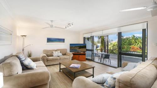 a living room with two couches and a tv at Terrigal Bay #9 Pool In Complex, Close To Beach Accom Holidays in Terrigal