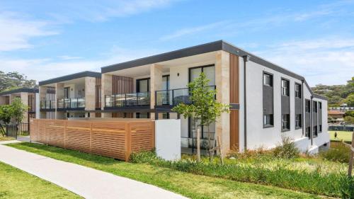a rendering of a house with a fence at #15 The Ash Apartments Close To Beach Accom Holidays in Terrigal