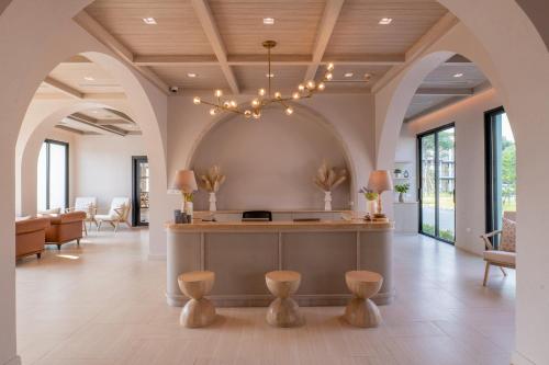 a lobby with a waiting area with a chandelier at Estella Khao Yai in Khao Yai