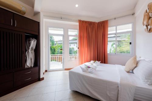 Postel nebo postele na pokoji v ubytování Twin Villas Ao Nang