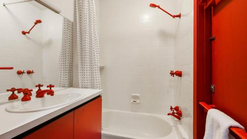 a white bathroom with a sink and a shower at Shamrock 8 in Mount Hotham