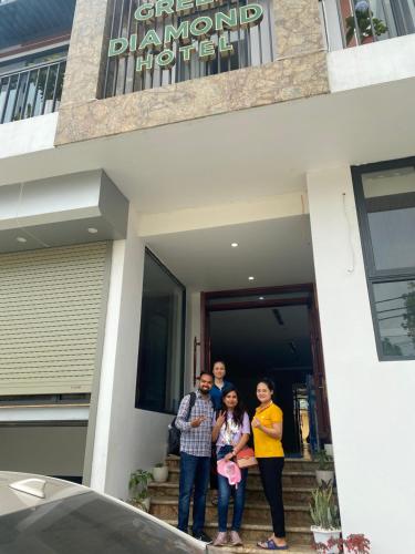 a group of people standing outside of a house at Hang Múa Green Mountain View House in Ninh Binh
