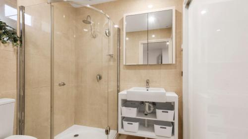 a bathroom with a shower and a sink at Brockhoff Lachen in Mount Hotham