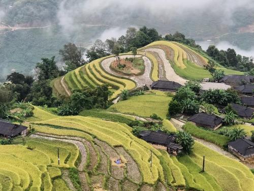 an aerial view of a village on a hill at Hoàng Su Phì - Móng Ngựa Homestay in Ha Giang