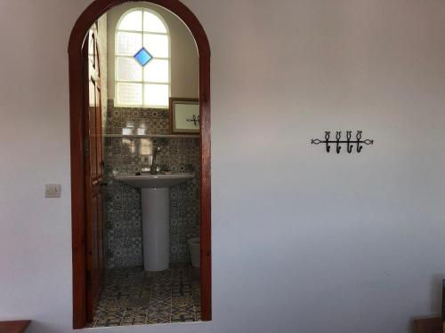a bathroom with a sink and a mirror at Dar Fatima in Chefchaouene