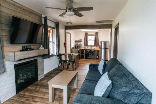 a living room with a couch and a fireplace at View Crest Lodge in Trinidad