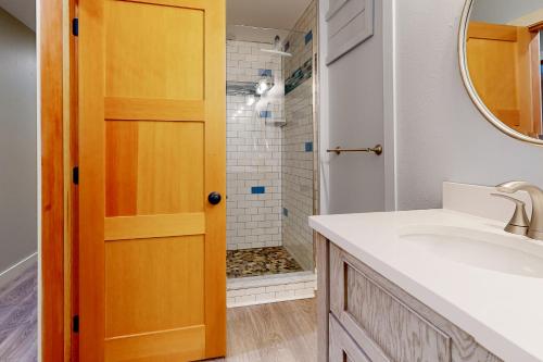 a bathroom with a sink and a shower at Mountain View Chalet in West Dover