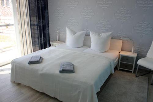 Ένα ή περισσότερα κρεβάτια σε δωμάτιο στο Käptn Brass Villa 4 App 6 Sonnenfänger