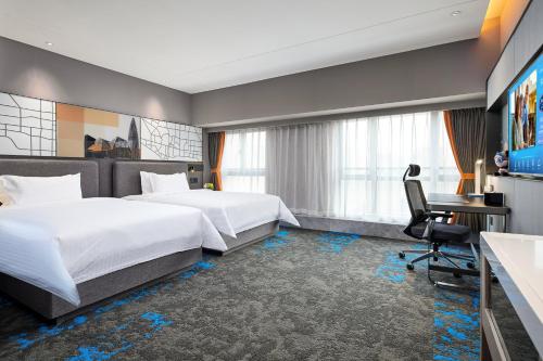 Letto o letti in una camera di Hampton by Hilton Shenzhen Dongmen