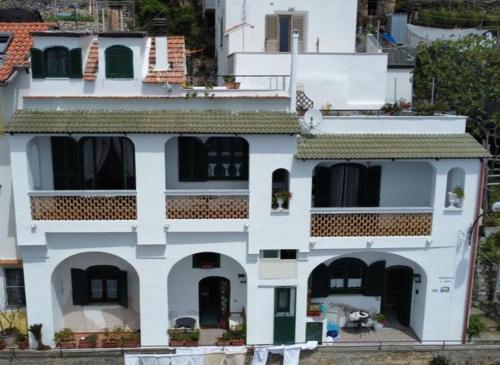 a large white building with a lot of windows at Casa Barbara in Amalfi