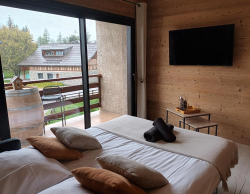 Säng eller sängar i ett rum på Appartement montagne LE FLOCON