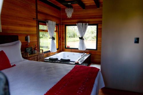 Postel nebo postele na pokoji v ubytování Pousada Caminho do Lago