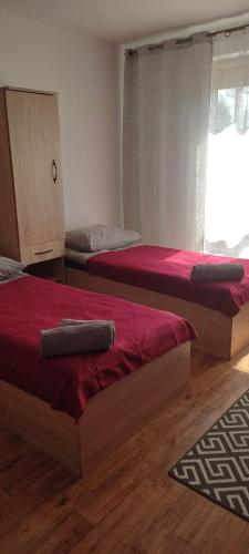 Ένα ή περισσότερα κρεβάτια σε δωμάτιο στο HOSTEL Róża