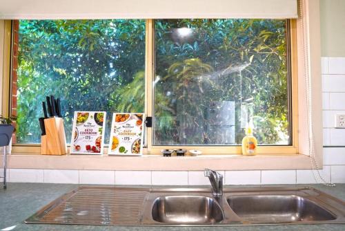 a sink in a kitchen with a window at Pet-Friendly Retreat 2BR Ringwood Prime location in Ringwood