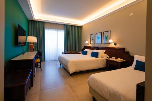 Una cama o camas en una habitación de Hotel Schuhmann