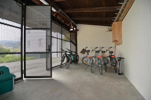 a group of bikes parked in a garage at Haus Wiesenstein in Lana