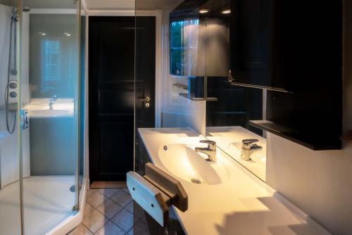 a bathroom with a sink and a shower at Storsten 730 in Trysil