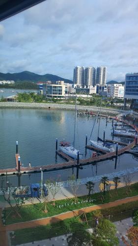 two boats are docked at a dock in a harbor at Lotte Castle Marina in Yeosu