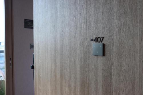 a door with the number on it at Hotel tt Gupo in Busan